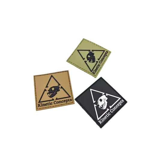 Three patches with 'Kinetic Concepts' logo on a white background